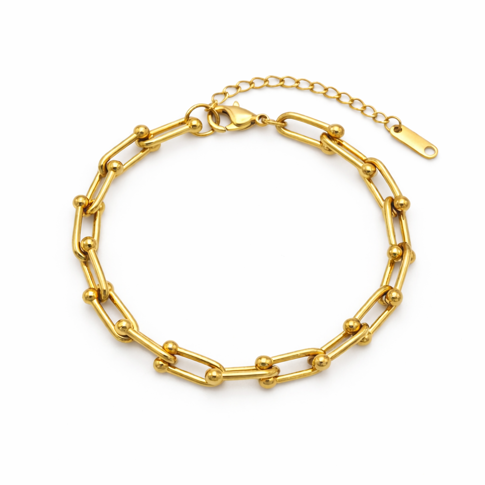 Gold chain bracelet on a white background