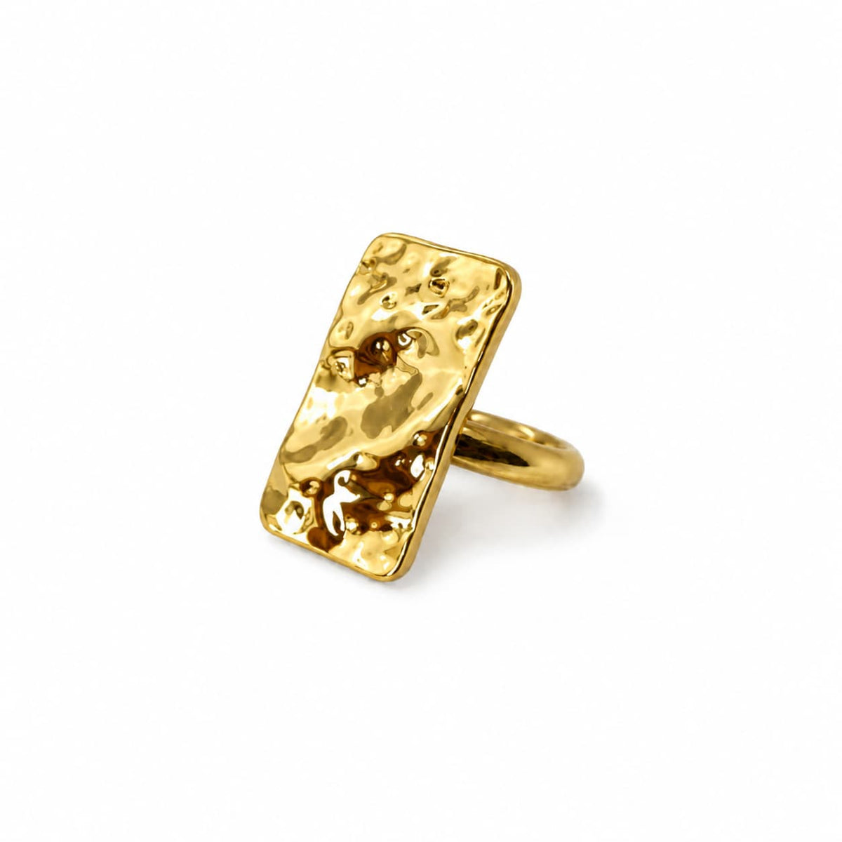 Gold ring with a textured surface on a white background