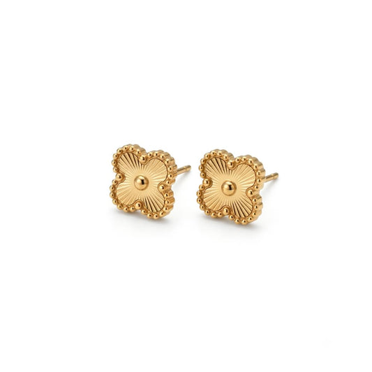 clover shaped gold color stainless steel earrings on white background