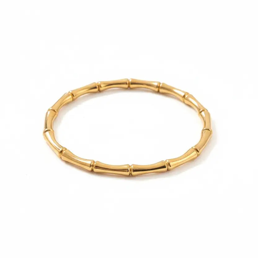 Gold bracelet on a white background