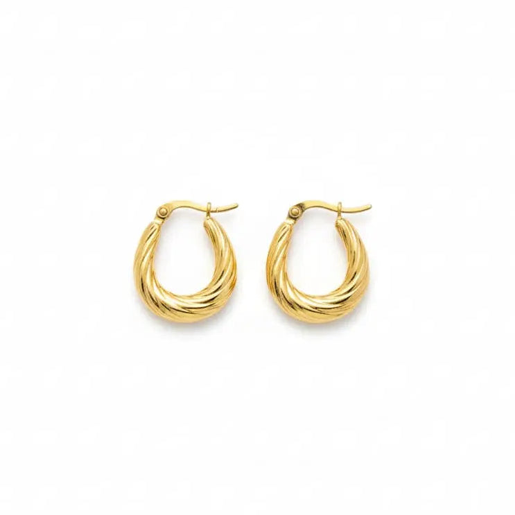 A pair of gold-toned twisted hoop earrings on a plain white background.
