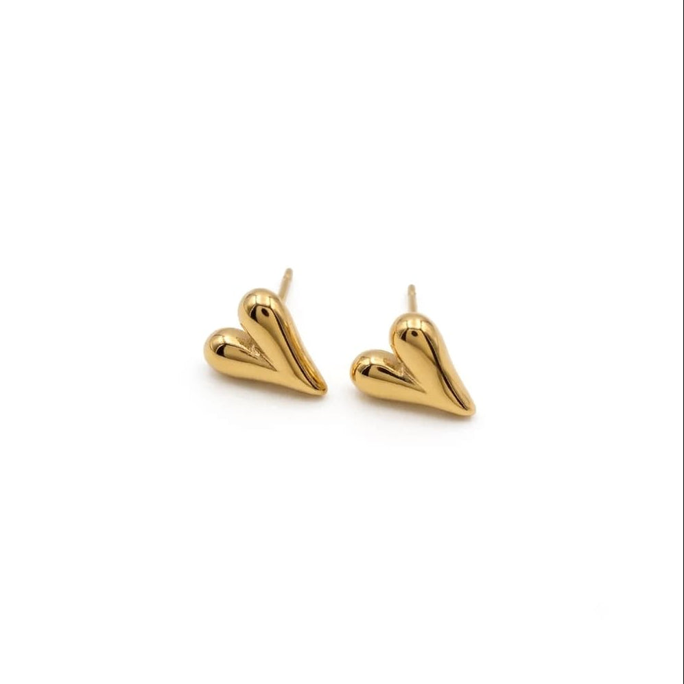 gold colored heart studs on white background